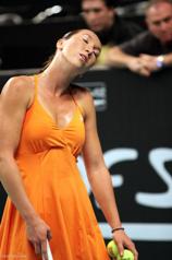 Jelena Jankovic in her orange ANTA dress