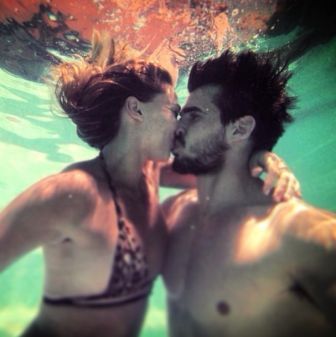 Tatiana Golovin kissing Hugo Bonneval under water