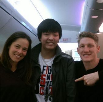 Ivanovic and Schweinsteiger take a photo with a fan