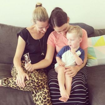 Casey Dellacqua with her partner and child