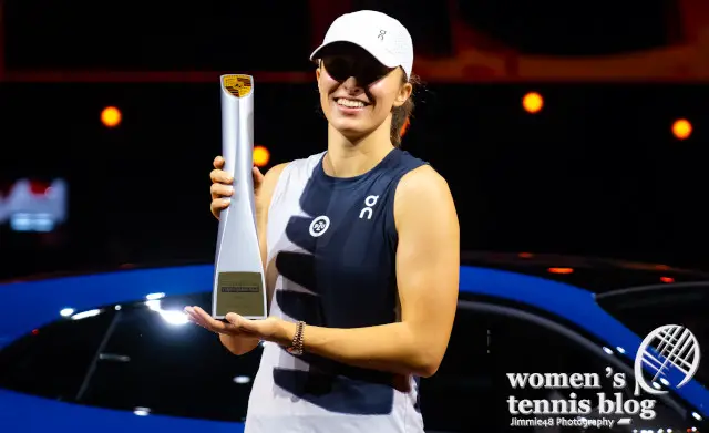 Iga Swiatek with the 2023 Porsche Tennis Grand Prix tennis trophy