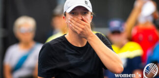 Iga Swiatek covers her mouth with her hand during a practice in Montreal