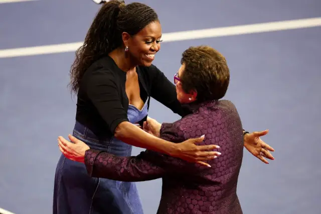Michelle Obama and Billie Jean King hug during the opening night at the 2023 US Open