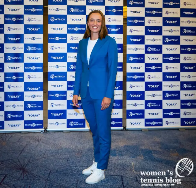 Iga Swiatek in a blue suit at the Tokyo players' party