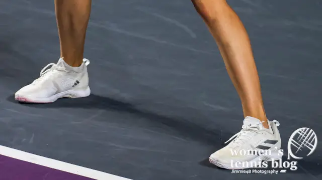 Elena Rybakina's white Adidas tennis shoes