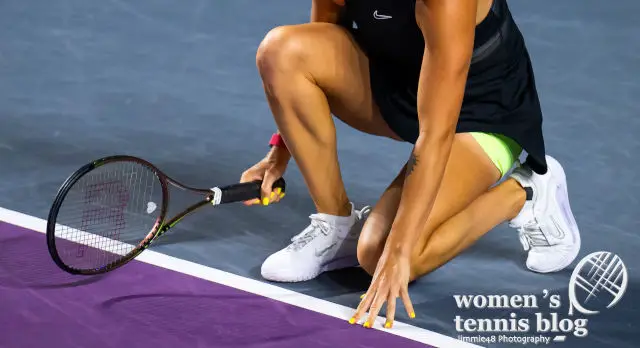 Aryna Sabalenka's tennis shoes and racquet at the WTA Finals in Cancun
