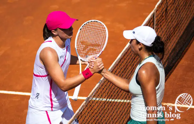 Iga Swiatek shakes hands with Madison Keys at the net in Rome