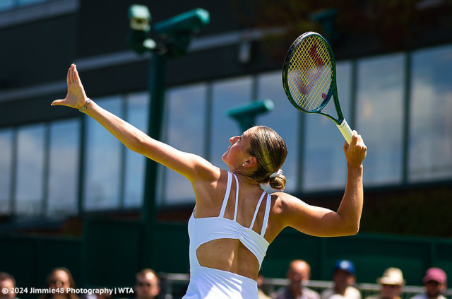 Marta Kostyuk in white Wilson tennis dress at Wimbledon 2024