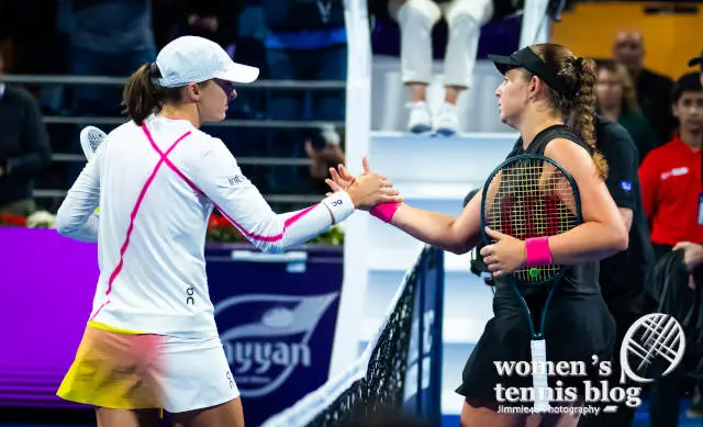 Jelena Ostapenko and Iga Swiatek shake hands at the net after their Doha semifinal