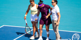 Injured Ons Jabeur helped by Jasmine Paolini to leave the court