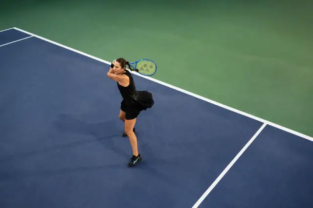 Belinda Bencic in Asics Night Energy tennis collection