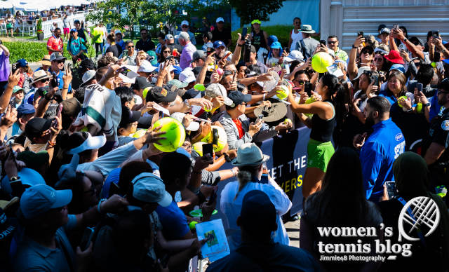 Eala signs autographs at the 2026 National Bank Open